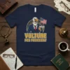 Vulture For President T-Shirt with a cartoon vulture in a suit holding an American flag and the words "Vulture For