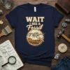 Wait I See A Fossil t-shirt design featuring a dinosaur skeleton being excavated by a paleontologist