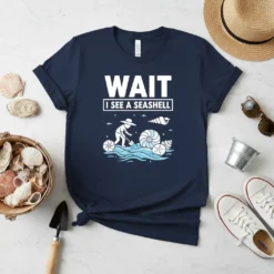 Wait I See A Seashell t-shirt design featuring a person digging for shells in the ocean waves