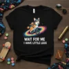 Black t-shirt with a corgi riding a bicycle on a rainbow with the text "WAIT FOR ME I HAVE LITTLE
