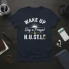 Christian t-shirt with text "WAKE UP Say a Prayer & H.U.ST.LE" and a sun graphic