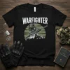 Black t-shirt with the word WARFIGHTER in white, above a graphic of a soldier's helmet, rifle, and mountains