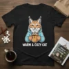 Warm & Cozy Cat t-shirt design featuring a lynx holding a mug of hot chocolate, text "WARM & COZY CAT"