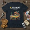 Warning Frequently Stops At Junkyards T-Shirt featuring a graphic of a junkyard scene with cars and buildings