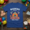 Warning It's A Circus Here Today text with circus tent and clowns graphic on a blue t-shirt
