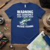 Blue t-shirt with white text "WARNING MAY RANDOMLY START TALKING ABOUT MUSKIE FISHING" and a graphic of a muskie fish