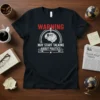 WARNING MAY START TALKING ABOUT POLITICS text with a graphic brain and microphone on a black t-shirt