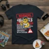 T-shirt with "WARNING Office 113 DANGER MANAGER" text, featuring a grumpy monster holding pizza and a game controller