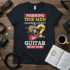 T-shirt with "WARNING THIS MEN PLANNING TO BUY GUITAR STOP HIM!" text and multiple guitars graphic