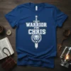 Warrior For Chris text design with sword, lion, and shield graphic on a royal blue t-shirt