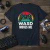 WASD MOVES ME text with a neon controller graphic on a navy t-shirt, ideal for PC gamers