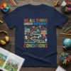We All Thrive Under Different Conditions text with colorful illustrations of people, books, and plants on a navy t-shirt