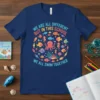 T-shirt with text "We Are All Different But In This School We All Swim Together" and colorful ocean fish, seahorses