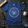 White text "We Are All Made of Stars" inside a star and circle graphic on a royal blue t-shirt