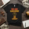 Black t-shirt with "WE ARE BLACK HISTORY LEGACY" text and a raised fist graphic featuring Pan-African colors