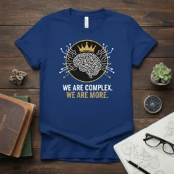 We Are Complex. We Are More. t-shirt with a stylized brain wearing a crown, surrounded by circuits