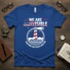 We Are Indivisible Together Our Voices Matter quote with lighthouse and crowd graphic on a blue t-shirt