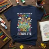 T-shirt with quote "We Are Like A Box Of Crayons Unique But When We Get Together Complete" and colorful art
