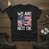 We Are Not Ok T-Shirt with distressed American flag and Statue of Liberty graphic, white distressed text