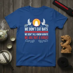 T-shirt with the bold text "WE DON'T EAT BATS WE DON'T ALL KNOW KARATE WE ARE NOT A VIRUS!" and