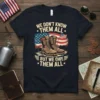 We Don't Know Them All But We Owe Them All patriotic t-shirt with military boots and American flag graphic