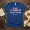Blue t-shirt with white text reading "WE HAVE THIS THING CALLED THE CONSTITUTION" and three white stars below
