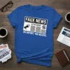 Blue t-shirt with "Faux News" headline, megaphone, newspaper graphic, and "We Report You Believe" slogan