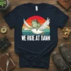 We Ride At Dawn t-shirt design with a frog wearing goggles riding a goose with a retro sunset background