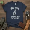 T-shirt with "We Rise By Lifting Others" text and graphic of people forming a human pyramid