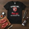 Black t-shirt with the quote "We Rub Our Meat Before We Stick It In" and cartoon salt and pepper shakers