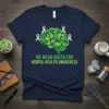 T-shirt with text "WE WEAR GREEN FOR MENTAL HEALTH AWARENESS" and a brain graphic made of green leaves with white