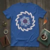 Blue t-shirt displaying the affirmations "We Will Know Peace, Truth, Enough" arranged in a circular gear pattern with a central