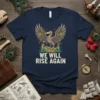 We Will Rise Again quote with a majestic bird graphic, featuring colorful flowers and ancient ruins on a navy t-shirt