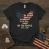 Black t-shirt with "WE THE PEOPLE EST. 1776" text and an eagle graphic with the American flag design