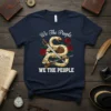 We The People WE THE PEOPLE t-shirt design with coiled snake, sword, book, rifle, and roses