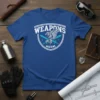 Blue t-shirt featuring the "WEAPONS 462/2W1" text with an eagle graphic and crossed swords in a shield design