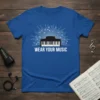 Wear Your Music piano keyboard design with musical notes radiating outwards, on a royal blue t-shirt