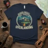Weekend Forecast: 100% Chance of Overlanding t-shirt featuring a green overland vehicle, campfire, and mountains graphic