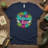 T-shirt with "WEEKEND hoe" text surrounded by colorful flowers, leaves, gardening tools, and pink gloves