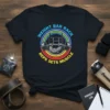 Weight Bar Rack Reps Sets Muscle t-shirt with graphic of a person lifting a barbell, gym equipment, and colorful rings