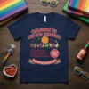 Welcome To Big Gay Pizzeria T-Shirt with cartoon pizza, fruits, and vegetables in pride colors. Includes text about gay deals