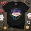 Black t-shirt featuring the iconic Welcome To Fabulous Las Vegas Nevada sign with colorful city skyline and stars