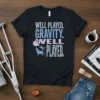 Well Played Gravity Well Played text design on a black t-shirt with a graphic of a person falling into a