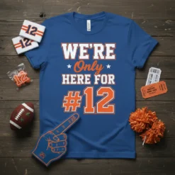 Blue t-shirt with white and orange text "WE'RE Only HERE FOR #12" for football fans