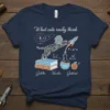 What cats really think t-shirt design featuring a cat in a space helmet launching a rocket, with scientific equations and