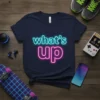Navy blue t-shirt with bright neon pink and blue "what's up" text design