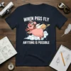 When Pigs Fly Anything Is Possible t-shirt with a cartoon pig wearing aviator goggles and scarf flying with wings through