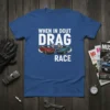 Blue t-shirt with "WHEN IN DOUT DRAG RACE" text, featuring two classic muscle cars racing with checkered flags