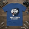 White Tiger Kingdom text overlaying a fierce white tiger graphic with black tribal accents on a blue t-shirt