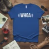 Blue t-shirt with "WHOA" in white text, surrounded by radiating lines. Design is for adventure lovers